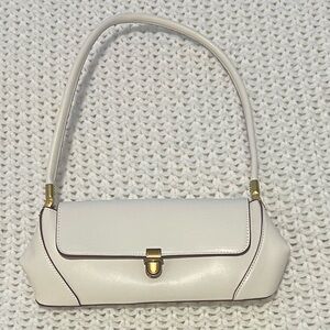 White purse with maroon detailing